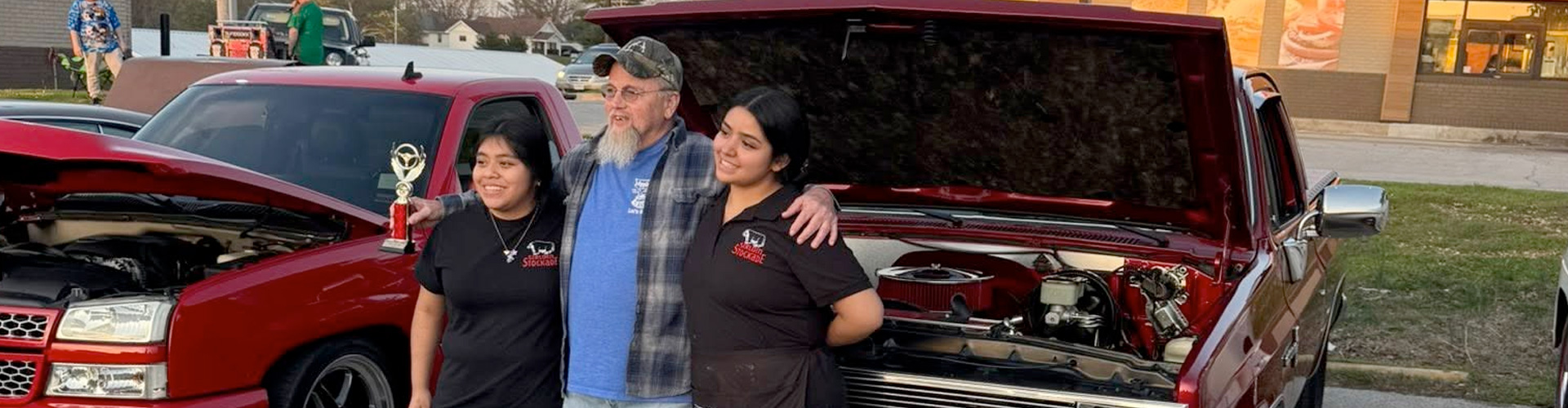With the hood open, a driver receives roadside assistance from All-American Towing & Recovery in Joplin, MO